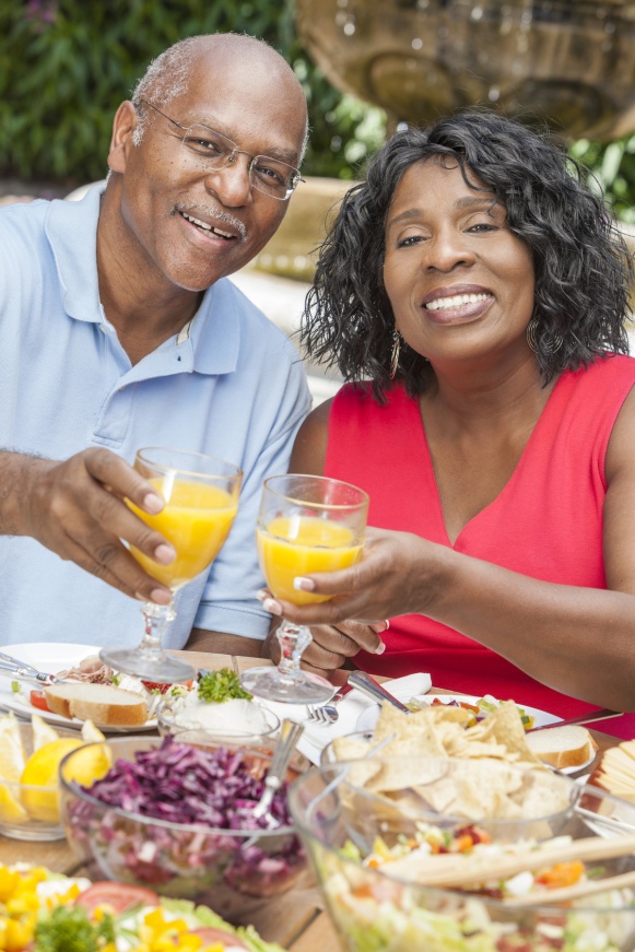 Senior African American Couple Drinking Orange Juice